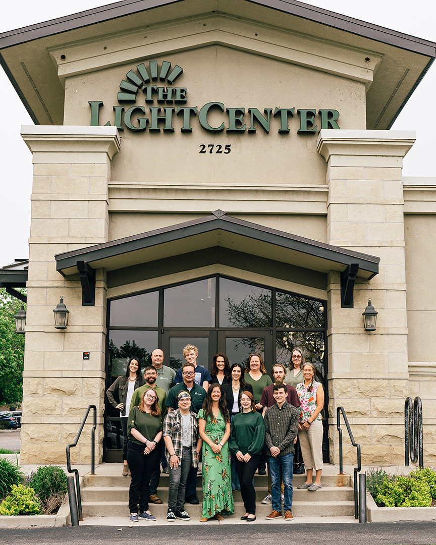 The knowledgeable staff at The Light Center posing in front of Fort Collins Location