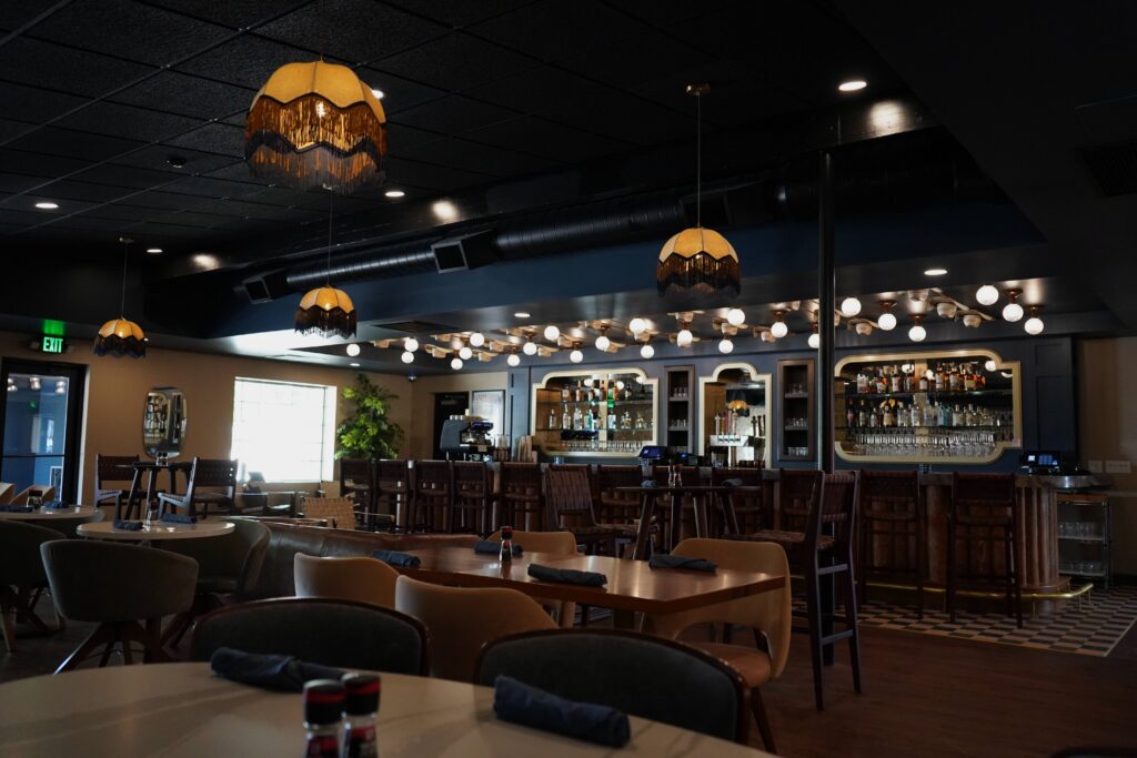 The Caldwell Bar at The Buxton Hotel in Fort Collins with custom pendant lights by The Light Center